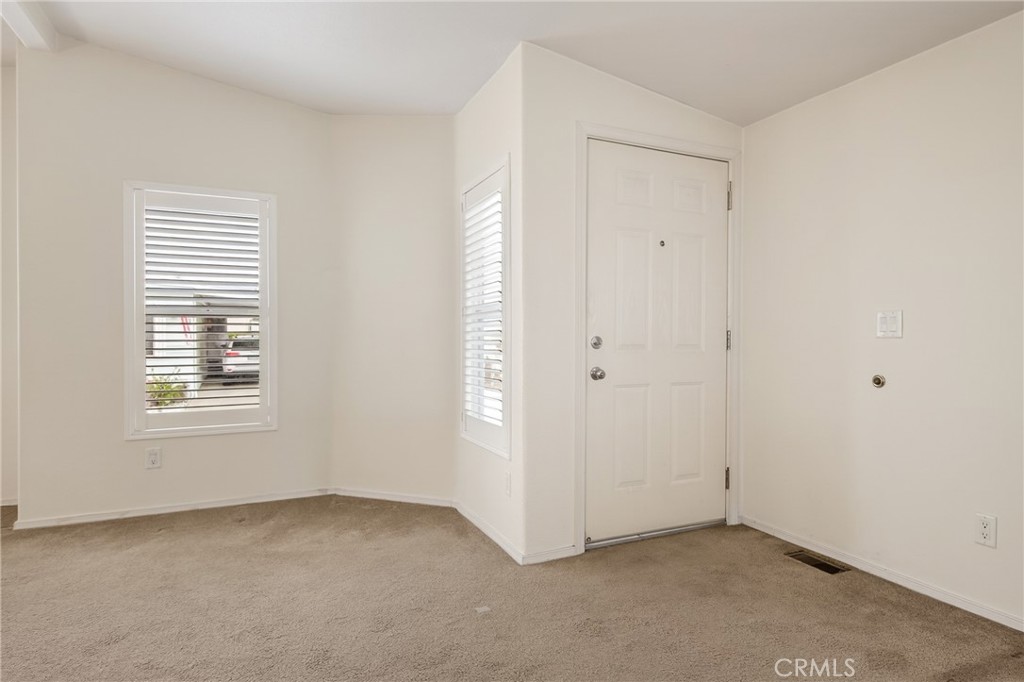 12367 4th Street, Unit 71 Yucaipa, CA 92399 - Photo 4 of 25 a view of an empty room with a window