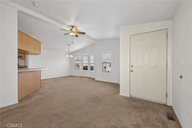 a view of a kitchen with cabinet and a ceiling fan