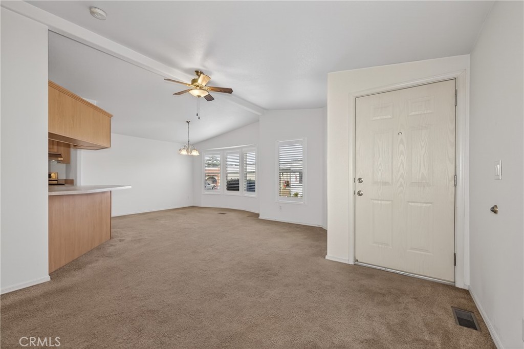 12367 4th Street, Unit 71 Yucaipa, CA 92399 - Photo 5 of 25 a view of a kitchen with cabinet and a ceiling fan