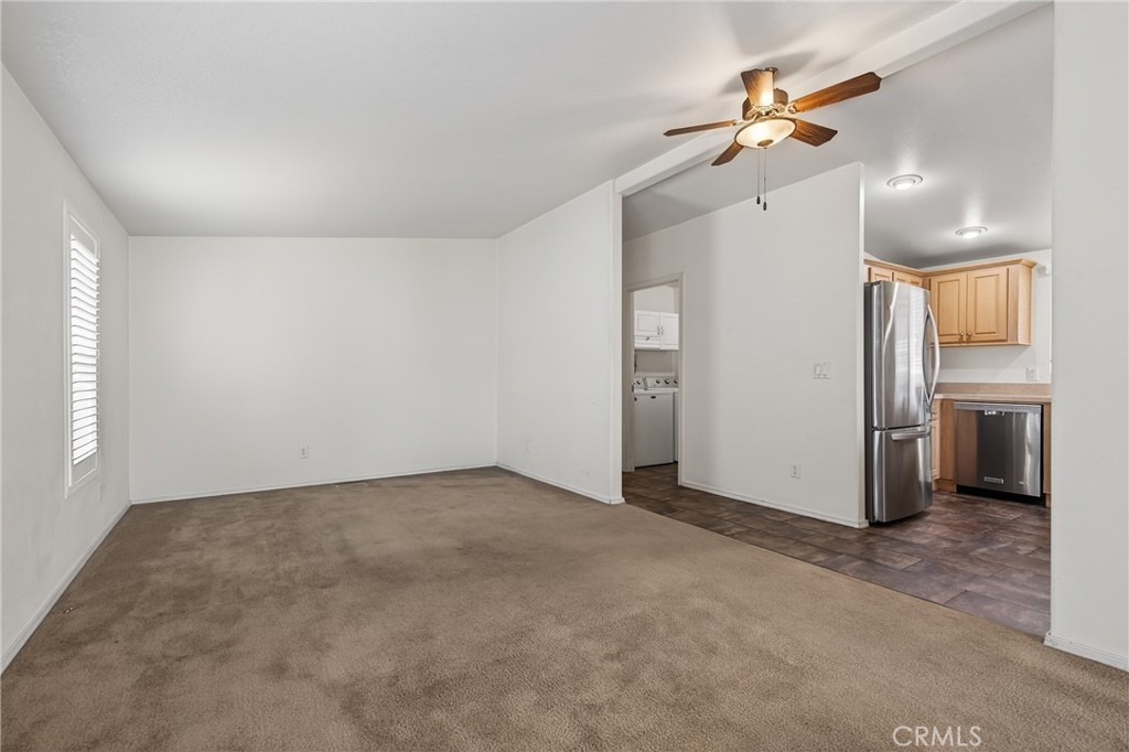 12367 4th Street, Unit 71 Yucaipa, CA 92399 - Photo 8 of 25 a view of a kitchen with a sink and refrigerator