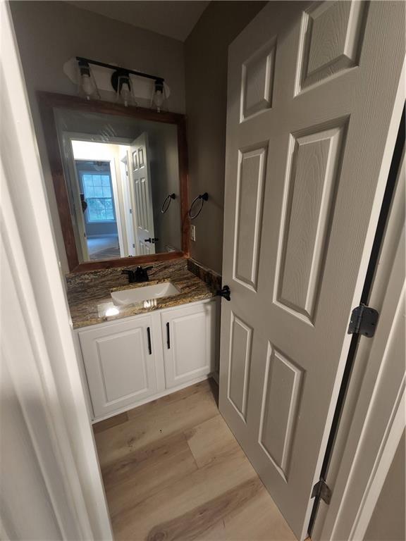 435 Butler Bridge Circle Covington, GA 30016 - Photo 17 of 25 a kitchen with white cabinets and white appliances