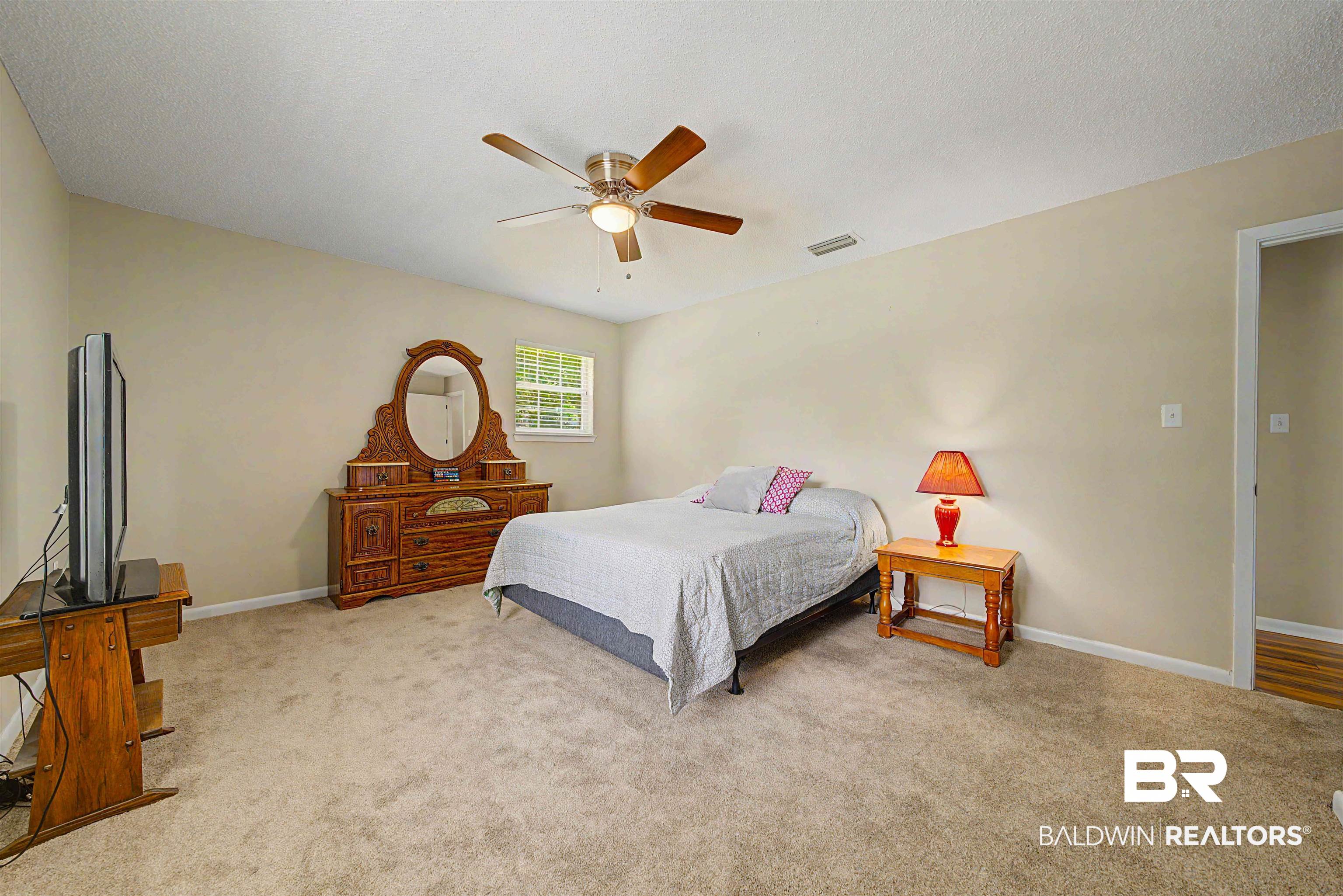 22963 Highway 98 Foley, AL 36535 - Photo 25 of 52 Carpeted room with a ceiling fan, recessed lighting, and a single window