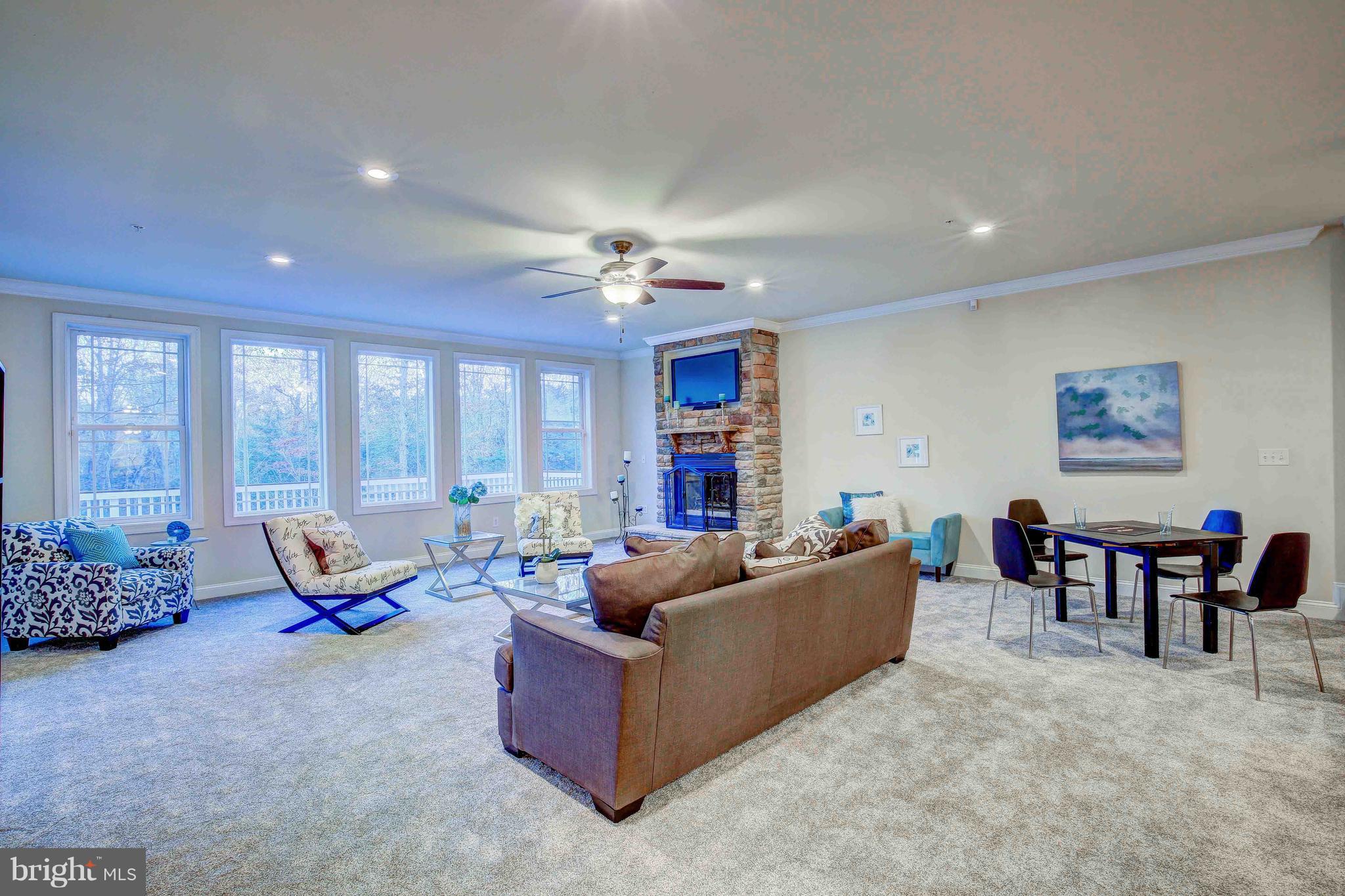 19120 Aquasco Road Brandywine, MD 20613 - Photo 17 of 63 Family Room-New Carpet-Stone FP-Custom Windows-Fan