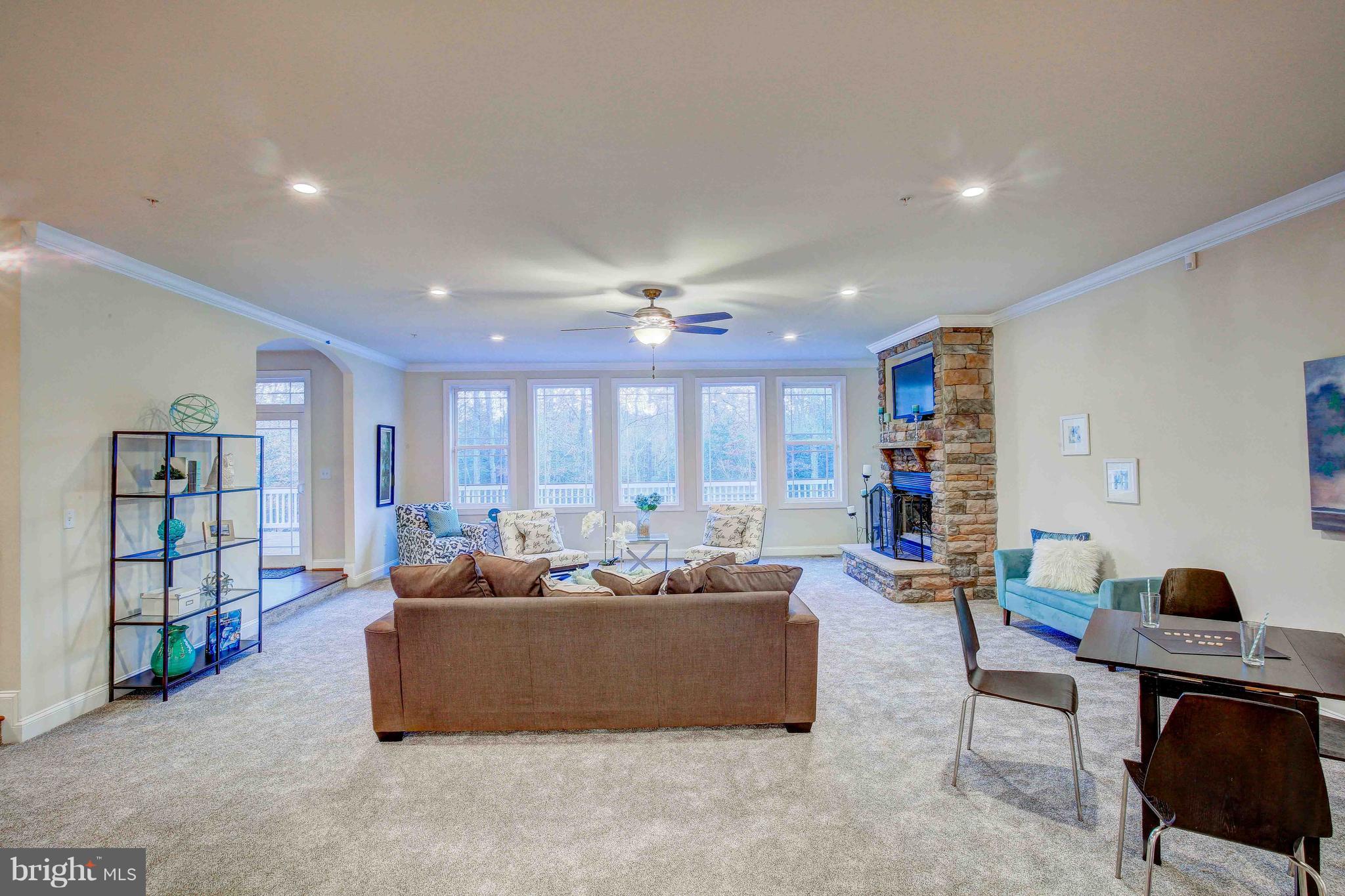 19120 Aquasco Road Brandywine, MD 20613 - Photo 19 of 63 Family Room-Custom Windows-Stone FP-New Carpet-Fan