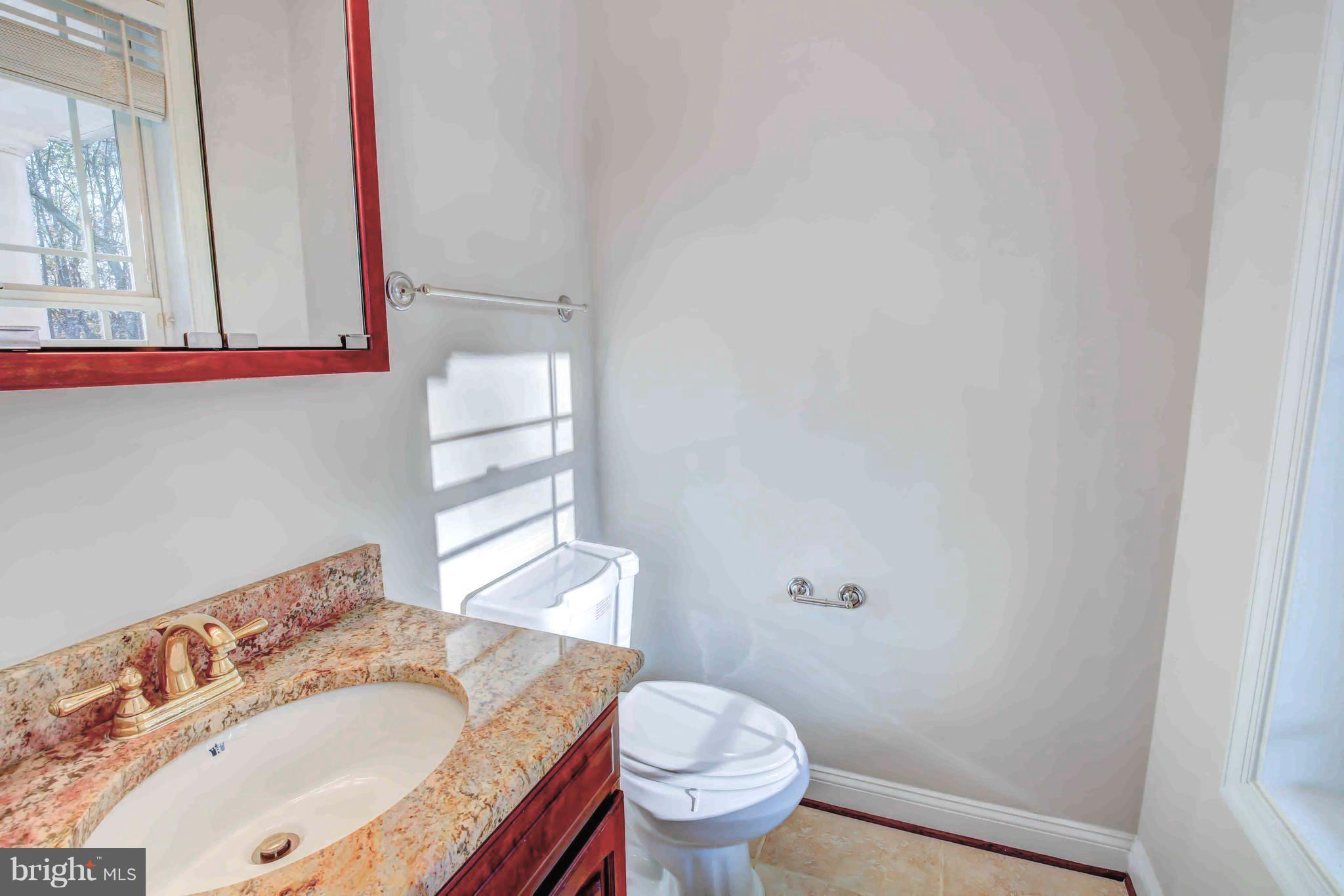 19120 Aquasco Road Brandywine, MD 20613 - Photo 29 of 63 Service Entry Powder Room w Ceramic Tile