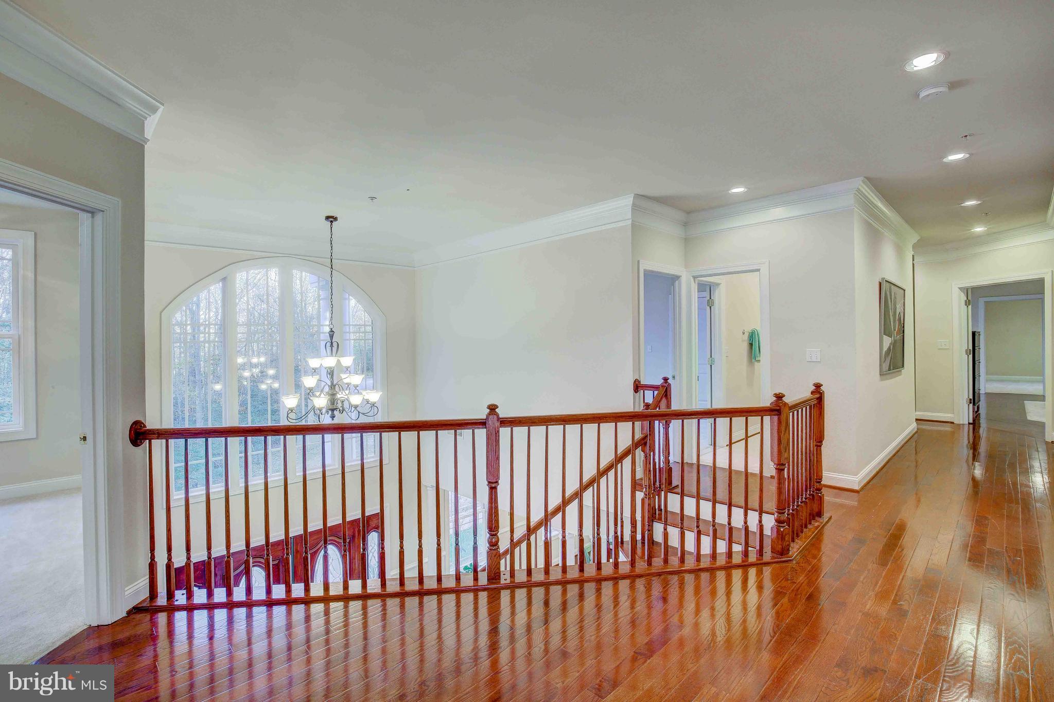 19120 Aquasco Road Brandywine, MD 20613 - Photo 30 of 63 Upper Level Hallway-Gleaming Hardwoods & Rails
