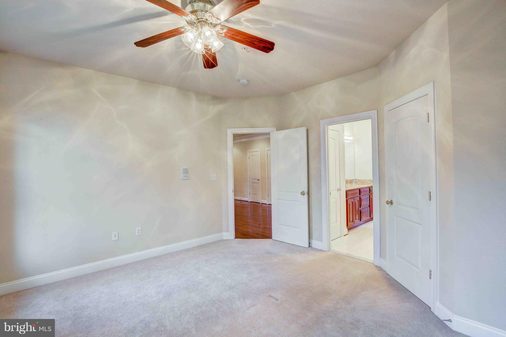 19120 Aquasco Road Brandywine, MD 20613 - Photo 49 of 63 Bedroom 1 - 13.6 x 13-walk-in closet-ceiling fan