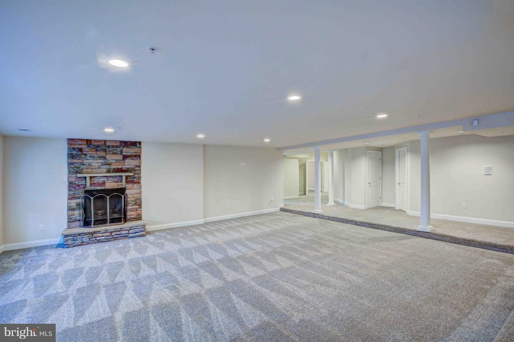 19120 Aquasco Road Brandywine, MD 20613 - Photo 54 of 63 Upscale Basement-Stone FP-Columns-New Carpet