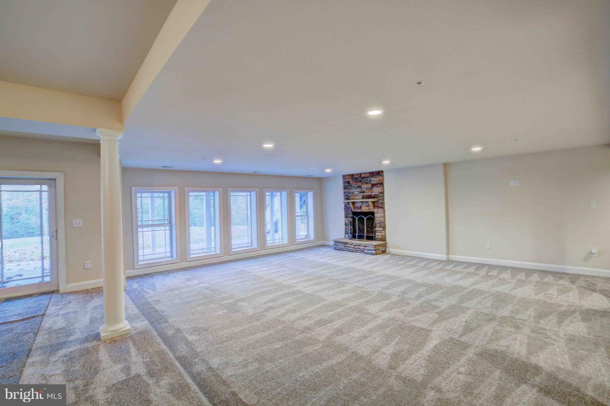 19120 Aquasco Road Brandywine, MD 20613 - Photo 57 of 63 Basement - 25 x 22.6 Step-Down Family Rm-Stone FP
