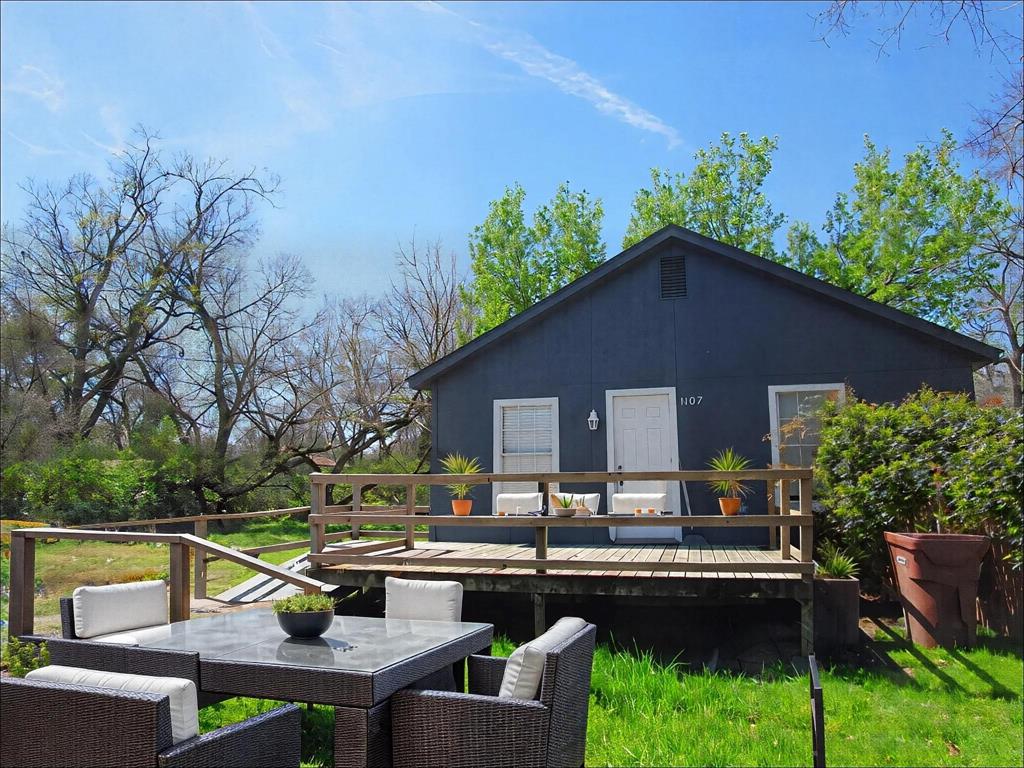 1107 Beech Street Bonham, TX 75418 - Photo 1 of 14 a view of house with outdoor seating