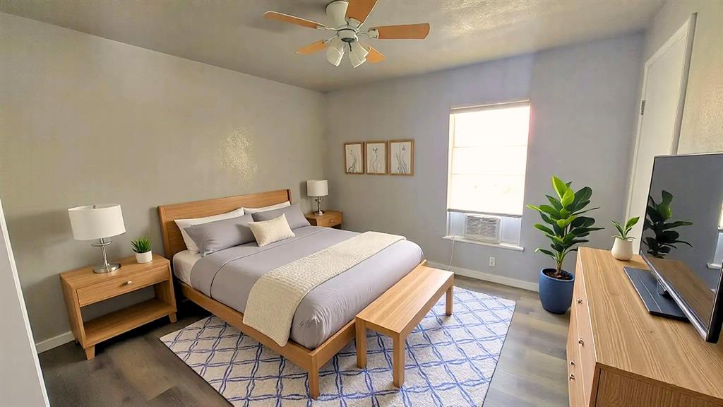 1107 Beech Street Bonham, TX 75418 - Photo 3 of 14 a bedroom with a bed table closet and a window