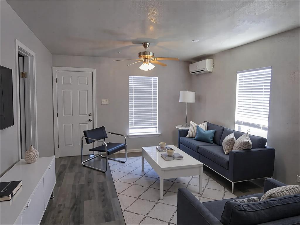 1107 Beech Street Bonham, TX 75418 - Photo 7 of 14 a living room with furniture a dining table and a window