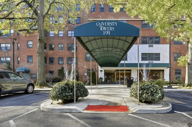 a front view of a building with garden