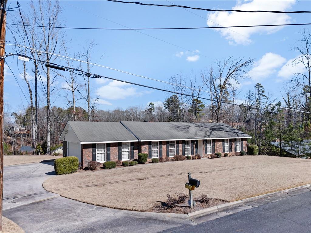 a front view of a house with a yard and sitting area
