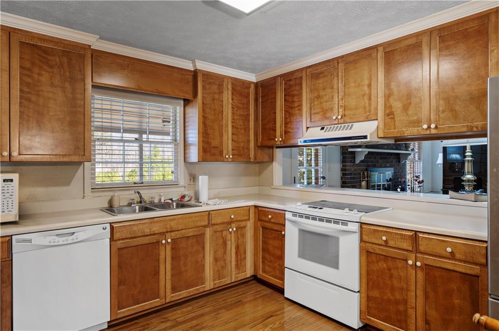 112 Thornwood Drive Southwest Rome, GA 30165 - Photo 11 of 30 a kitchen with stainless steel appliances granite countertop a sink and cabinets