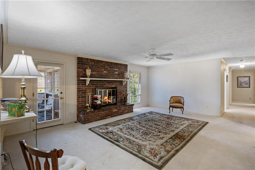 112 Thornwood Drive Southwest Rome, GA 30165 - Photo 15 of 30 a living room with furniture and a fireplace