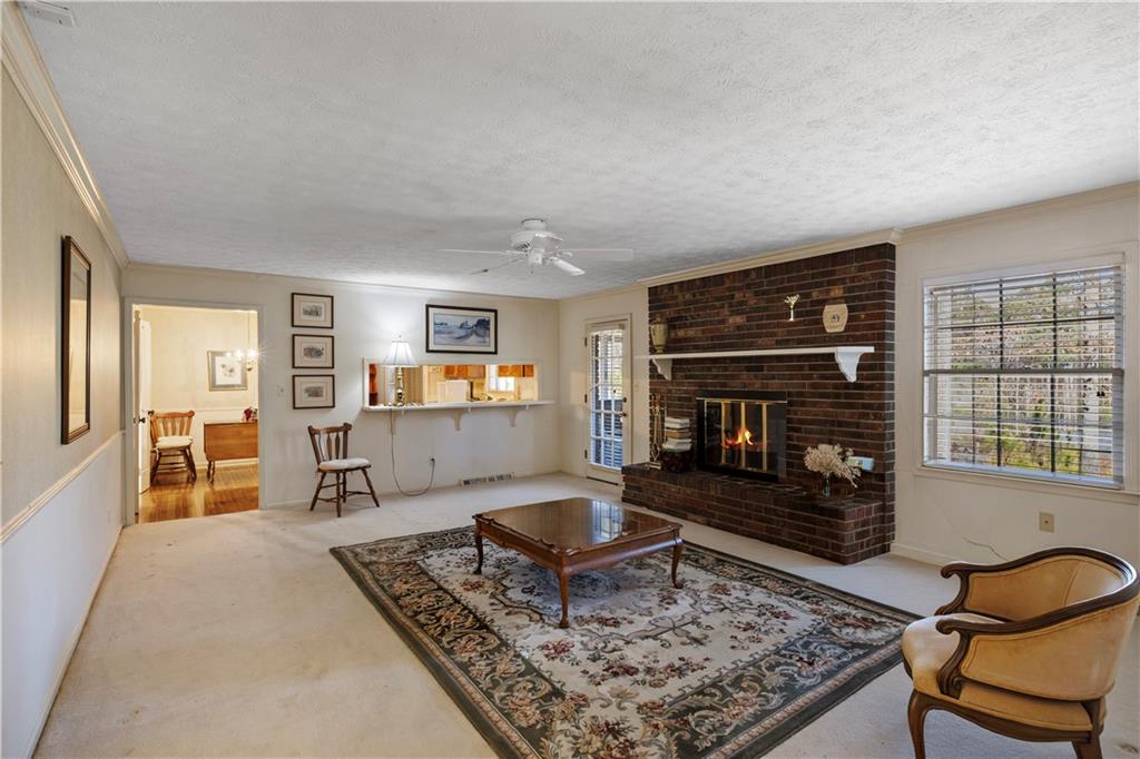 112 Thornwood Drive Southwest Rome, GA 30165 - Photo 16 of 30 a living room with furniture and a fireplace