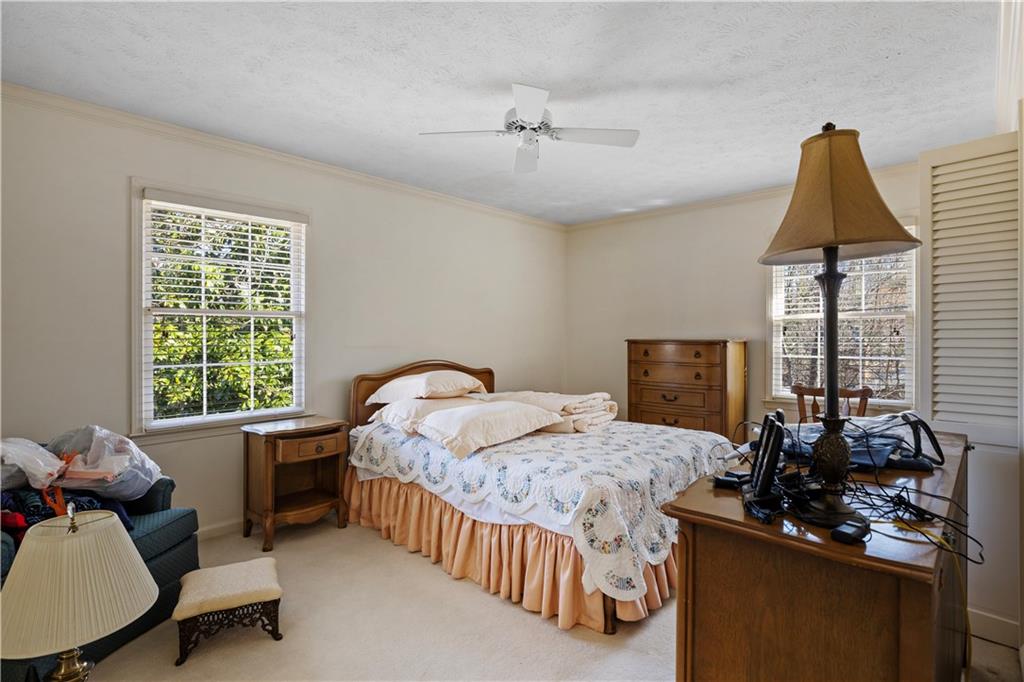 112 Thornwood Drive Southwest Rome, GA 30165 - Photo 22 of 30 a bedroom with a bed and a desk