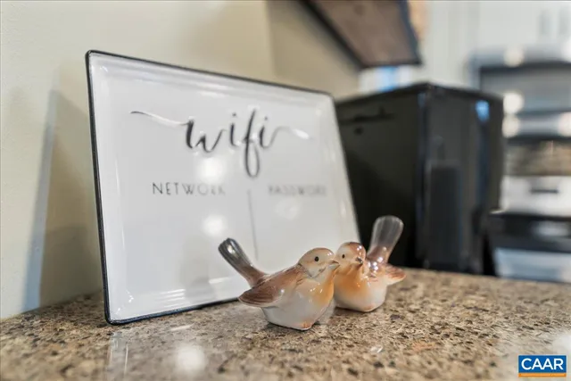 a living room with furniture fireplace and a potted plant