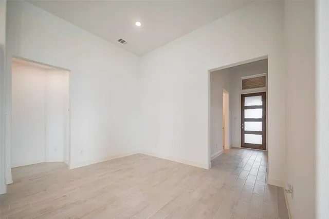 a view of an empty room and window