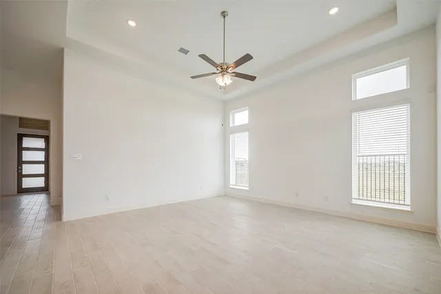 a kitchen with stainless steel appliances kitchen island granite countertop a refrigerator and a stove top oven