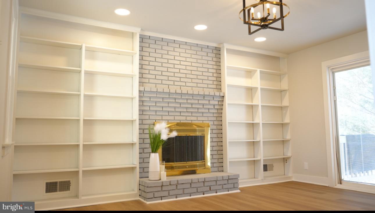 5114 Montgomery Road Ellicott City, MD 21043 - Photo 11 of 34 Modern elegance with a cozy fireplace.