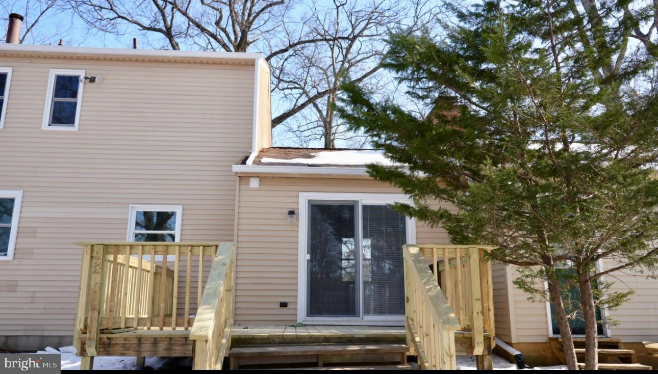 5114 Montgomery Road Ellicott City, MD 21043 - Photo 14 of 34 Charming home with inviting deck and greenery.