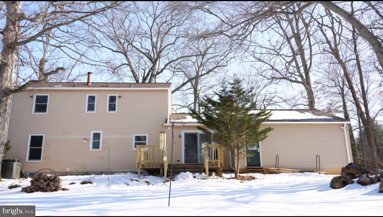 5114 Montgomery Road Ellicott City, MD 21043 - Photo 15 of 34 Charming home nestled in a snowy landscape.