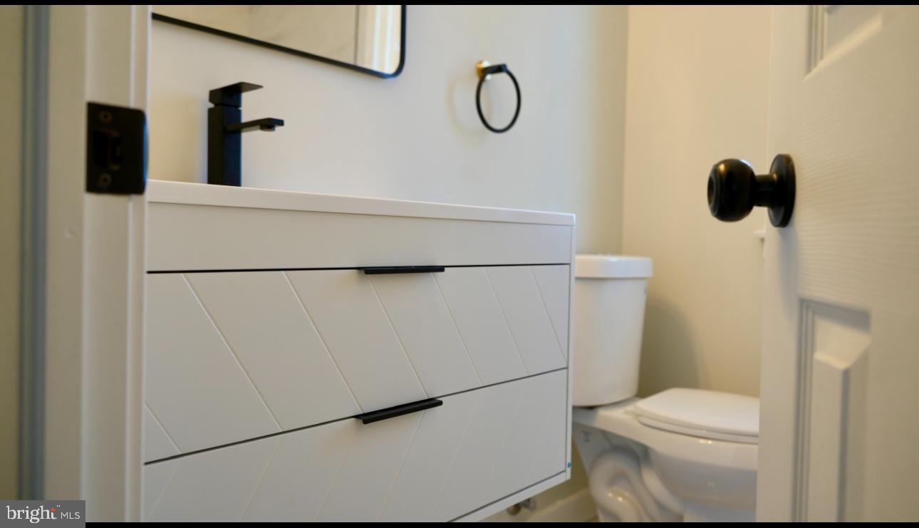 5114 Montgomery Road Ellicott City, MD 21043 - Photo 16 of 34 Sleek modern bathroom with stylish fixtures.