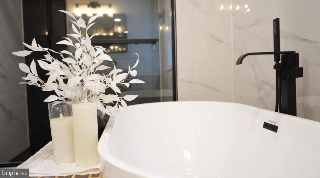 5114 Montgomery Road Ellicott City, MD 21043 - Photo 19 of 34 Serene bathroom oasis with elegant decor.
