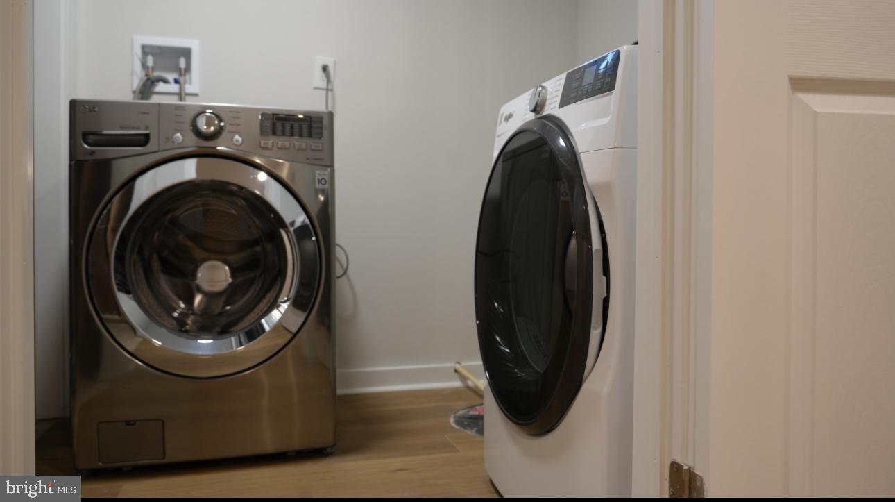 5114 Montgomery Road Ellicott City, MD 21043 - Photo 23 of 34 Modern laundry space with sleek appliances.
