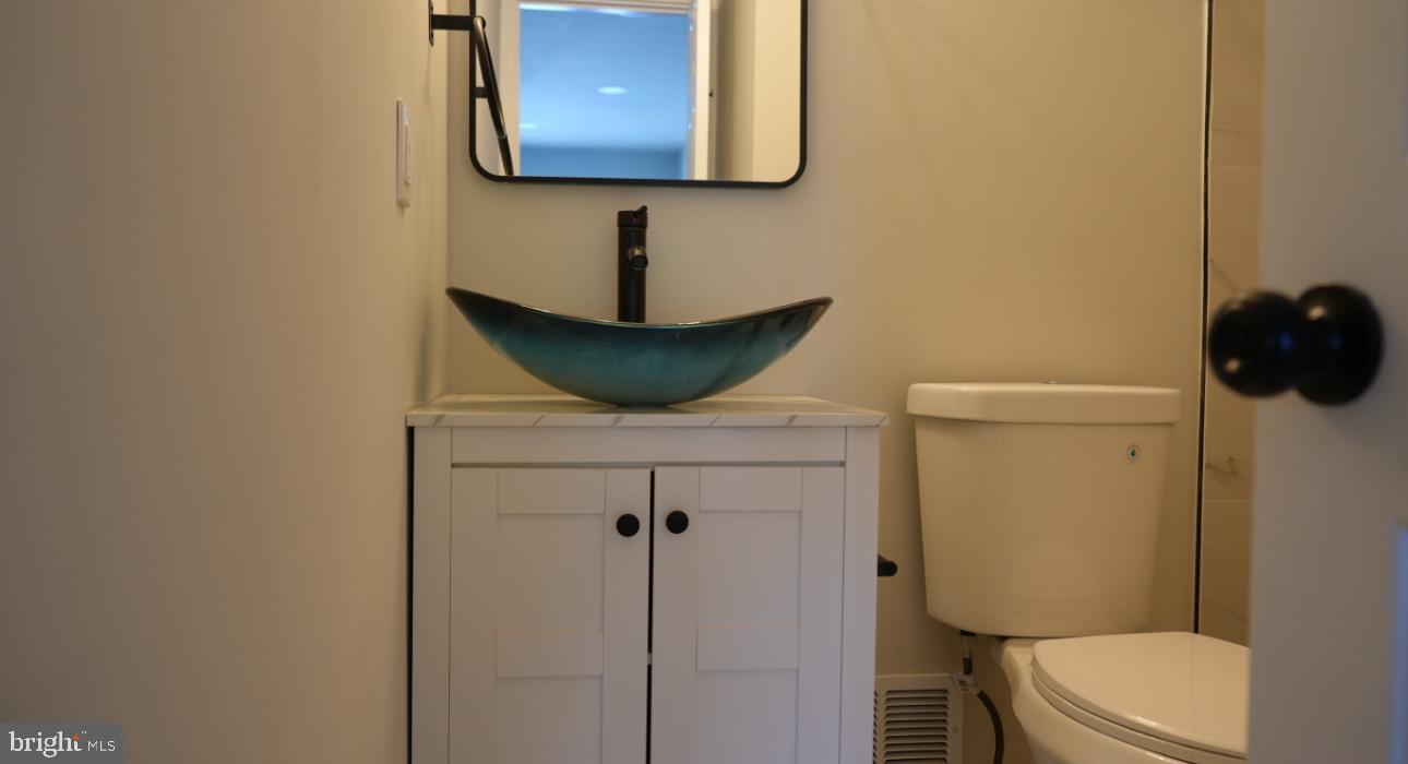 5114 Montgomery Road Ellicott City, MD 21043 - Photo 25 of 34 Chic half-bath with modern accents.