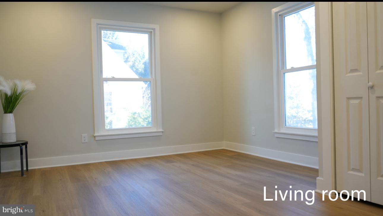 5114 Montgomery Road Ellicott City, MD 21043 - Photo 28 of 34 Bright and airy living room with natural light.