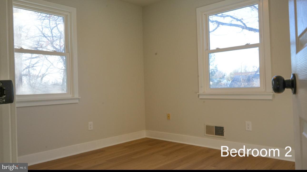 5114 Montgomery Road Ellicott City, MD 21043 - Photo 33 of 34 Bright and airy bedroom with natural light.