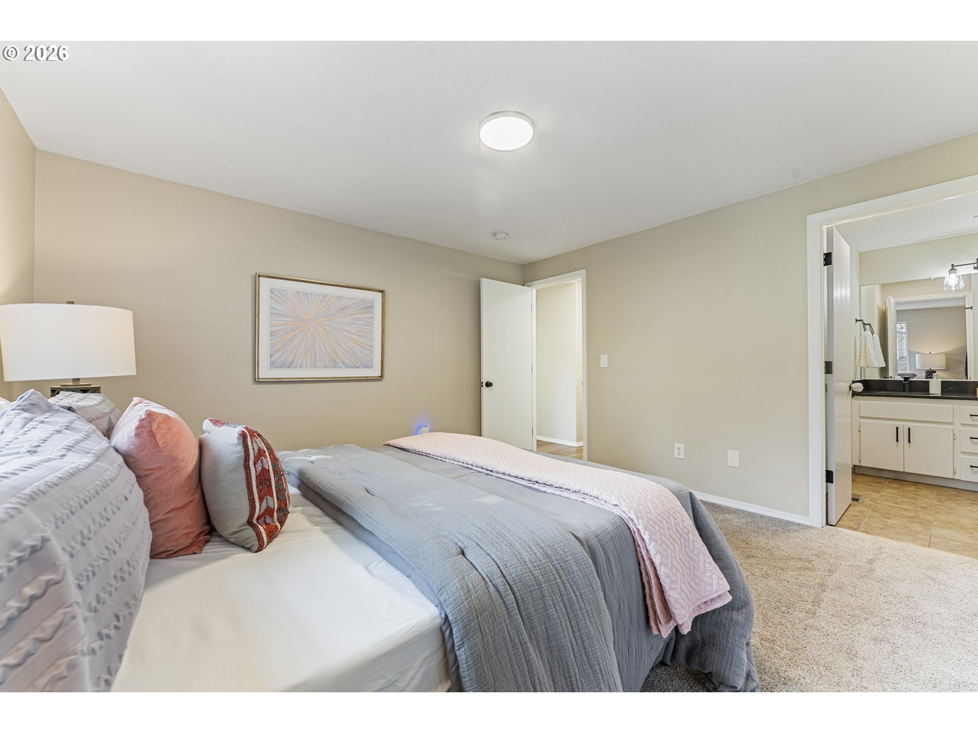 4024 Southeast 154th Place Portland, OR 97236 - Photo 12 of 43 a bedroom with a bed and a couch