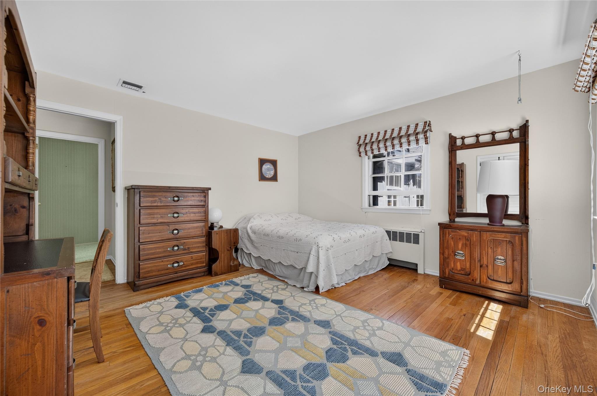 325 Birch Hill Road Locust Valley, NY 11560 - Photo 15 of 18 Bedroom with Wood Floor
