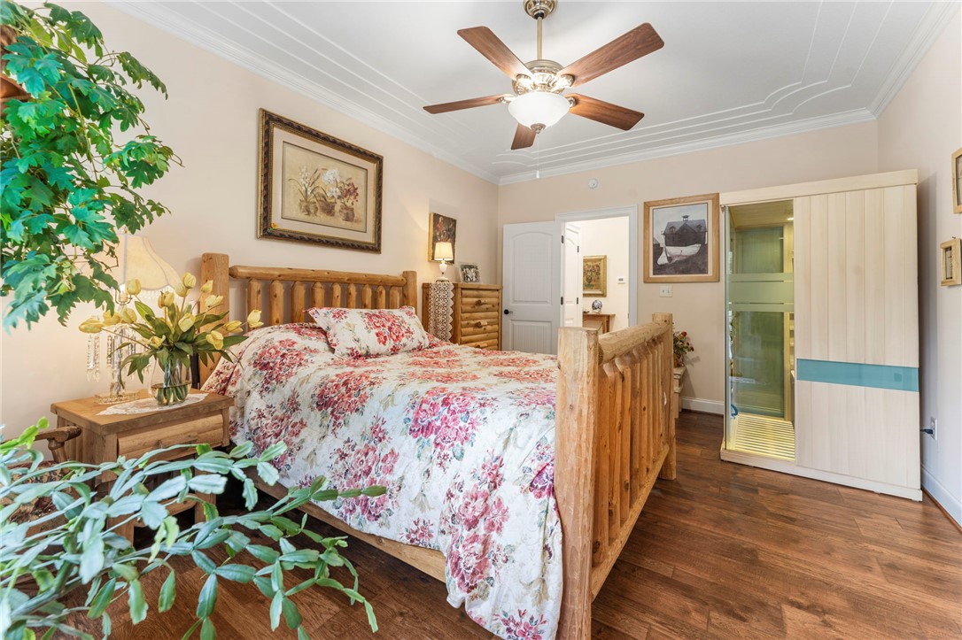 160 Sentell Road Williamston, SC 29697 - Photo 15 of 45 A tranquil bedroom retreat features rich wood flooring, intricate ceiling trim, and a serene personal sauna.