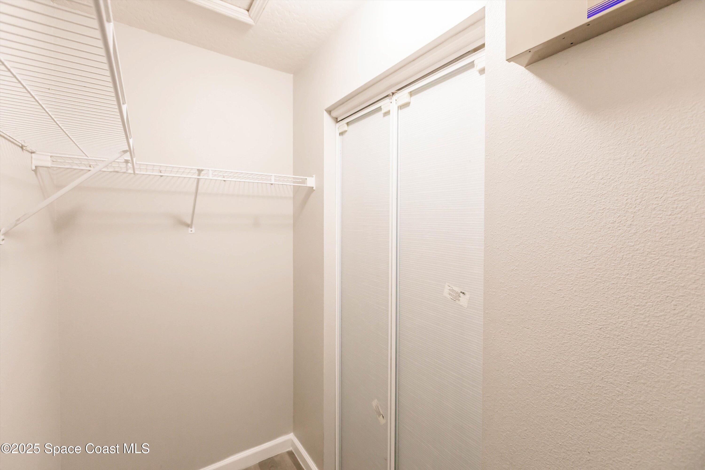 3061 Tazewell Avenue Southeast Palm Bay, FL 32909 - Photo 20 of 30 a bathroom with a glass shower door