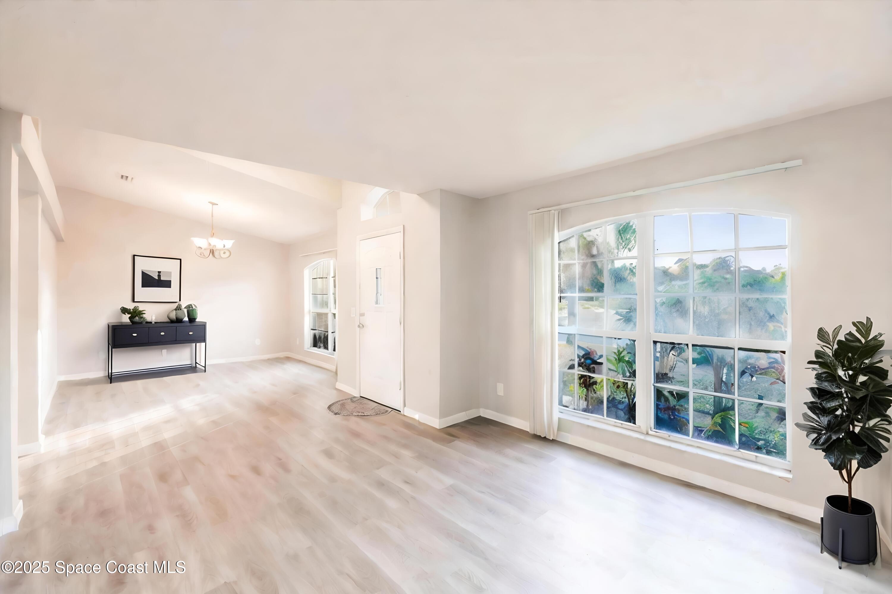 3061 Tazewell Avenue Southeast Palm Bay, FL 32909 - Photo 3 of 30 a view of an empty room with a window