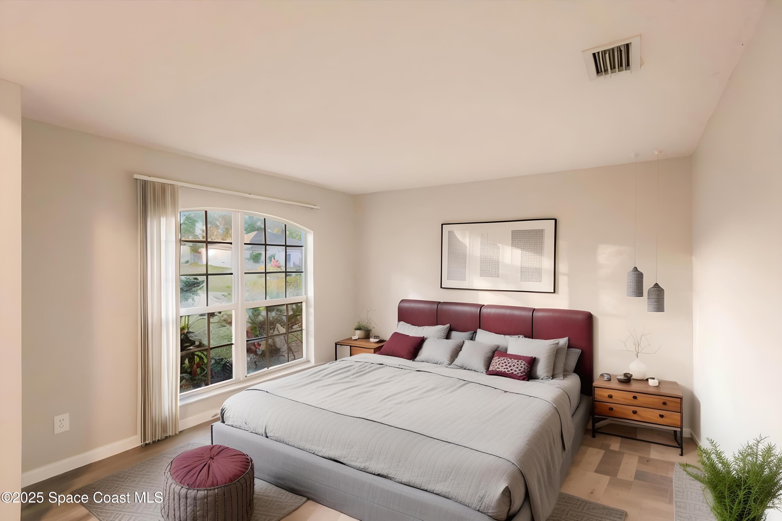 3061 Tazewell Avenue Southeast Palm Bay, FL 32909 - Photo 6 of 30 a bedroom with a bed and window