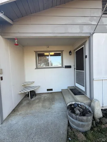 a living room with furniture and a chair