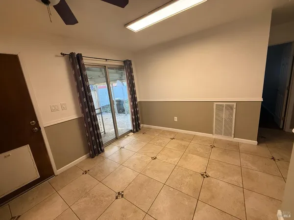 a view of an empty room with a window