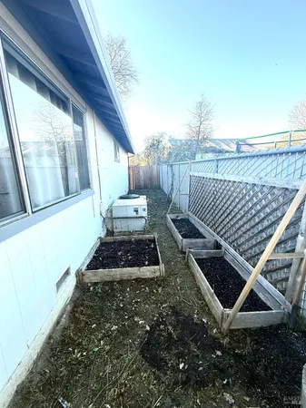 a backyard of a house with lots of green space