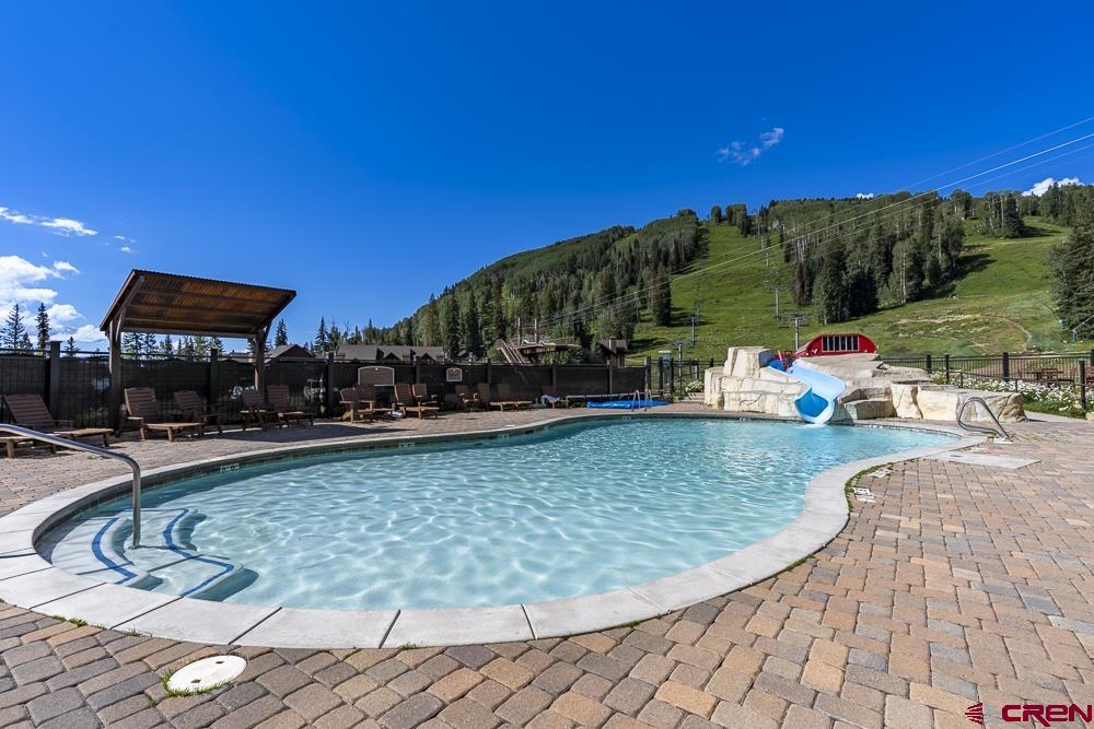 117 Needles Way, Unit 624 Durango, CO 81301 - Photo 19 of 32 a view of a swimming pool with a patio