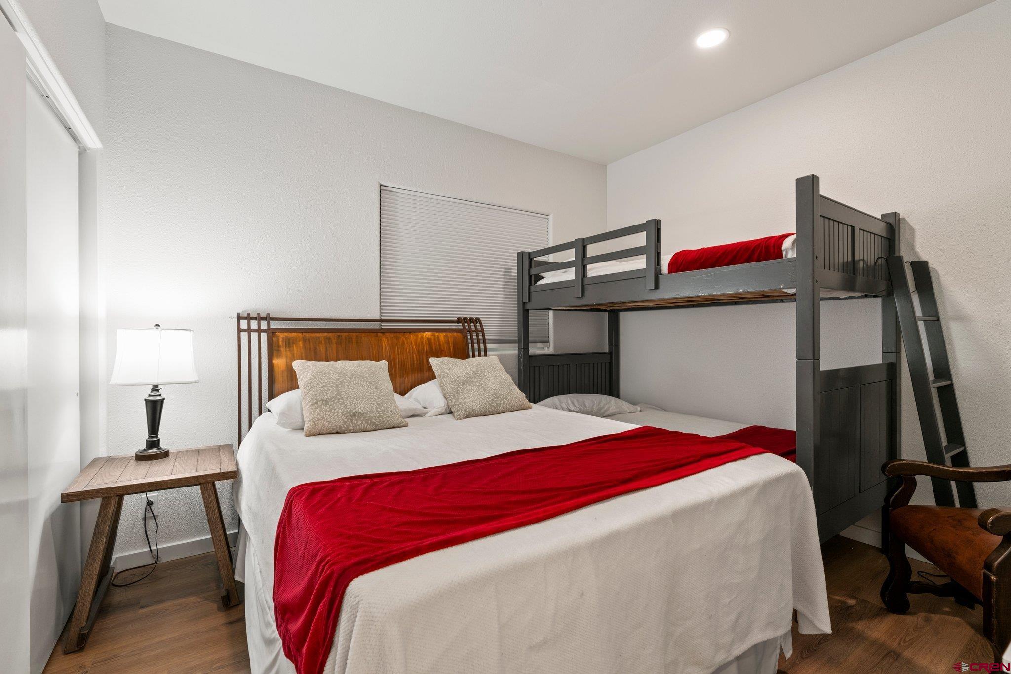 117 Needles Way, Unit 624 Durango, CO 81301 - Photo 7 of 32 a bedroom with a bed and closet