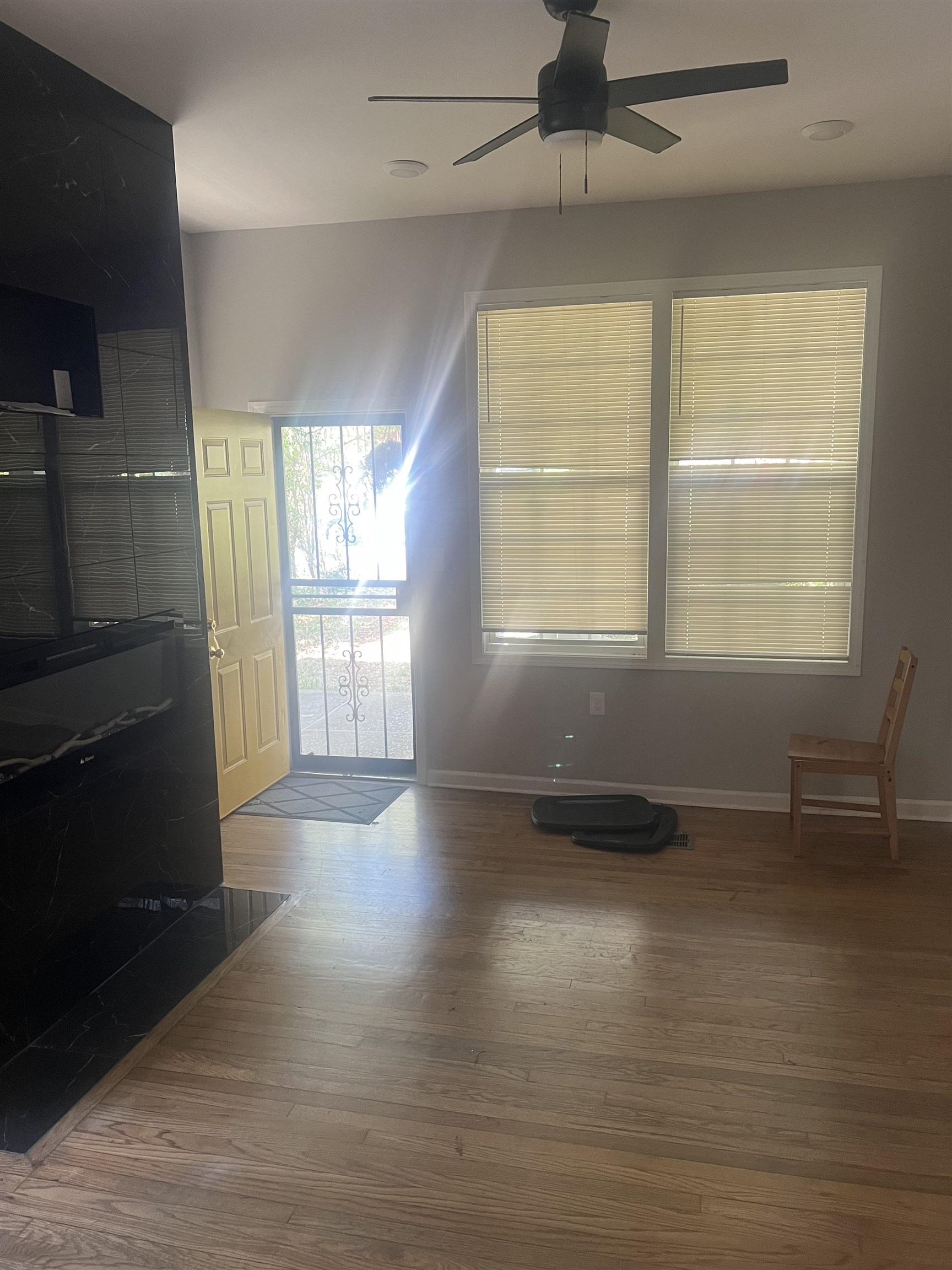 1353 Harbert Avenue Memphis, TN 38104 - Photo 5 of 18 a view of an empty room with a window and wooden floor