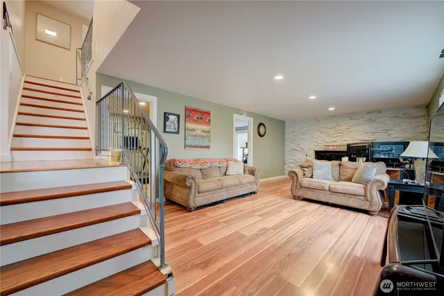 a living room with furniture and a chandelier