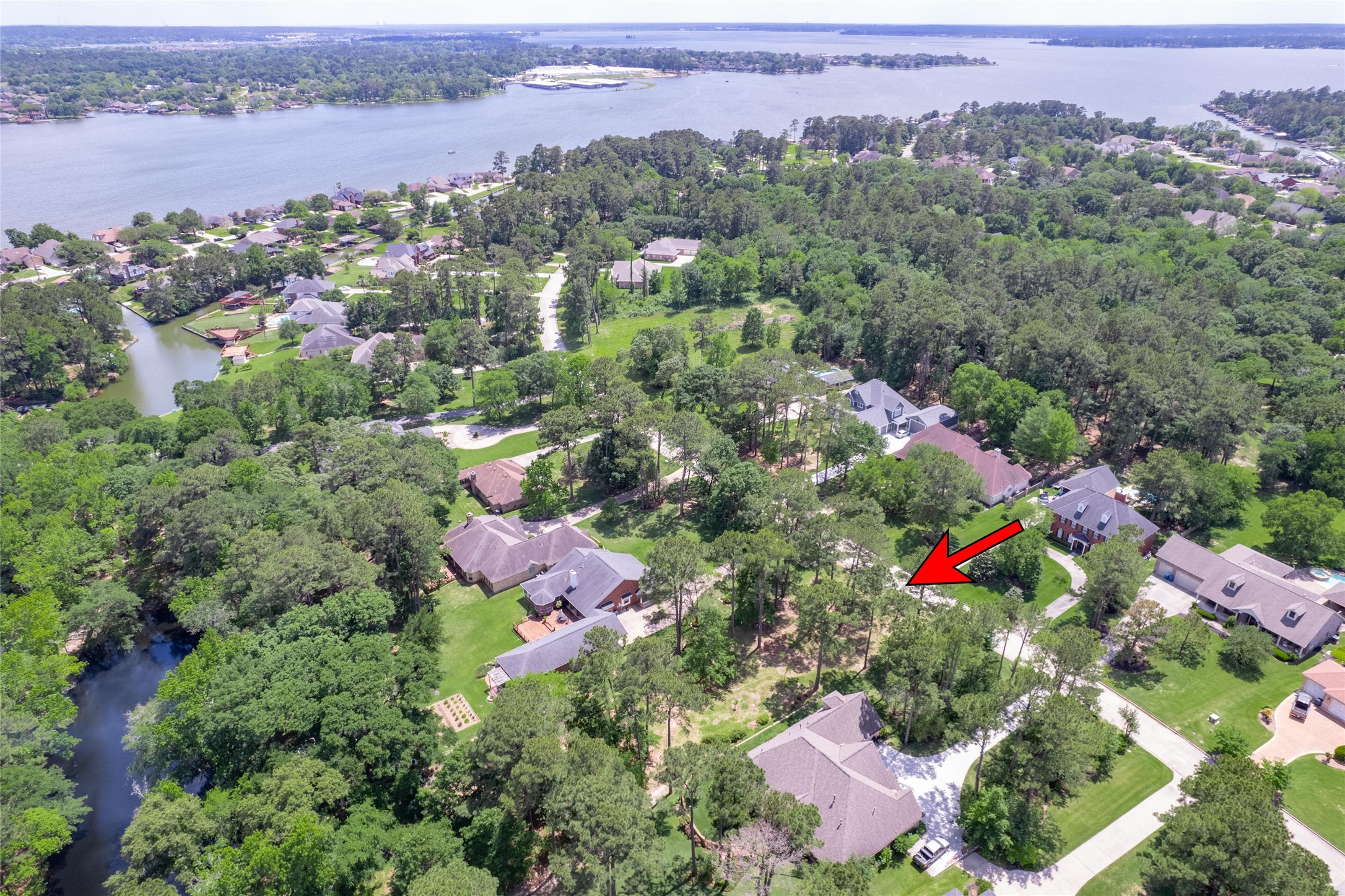 12868 Aries Loop Willis, TX 77318 - Photo 12 of 15 an aerial view of multiple house with yard