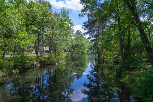 a view of lake with green space