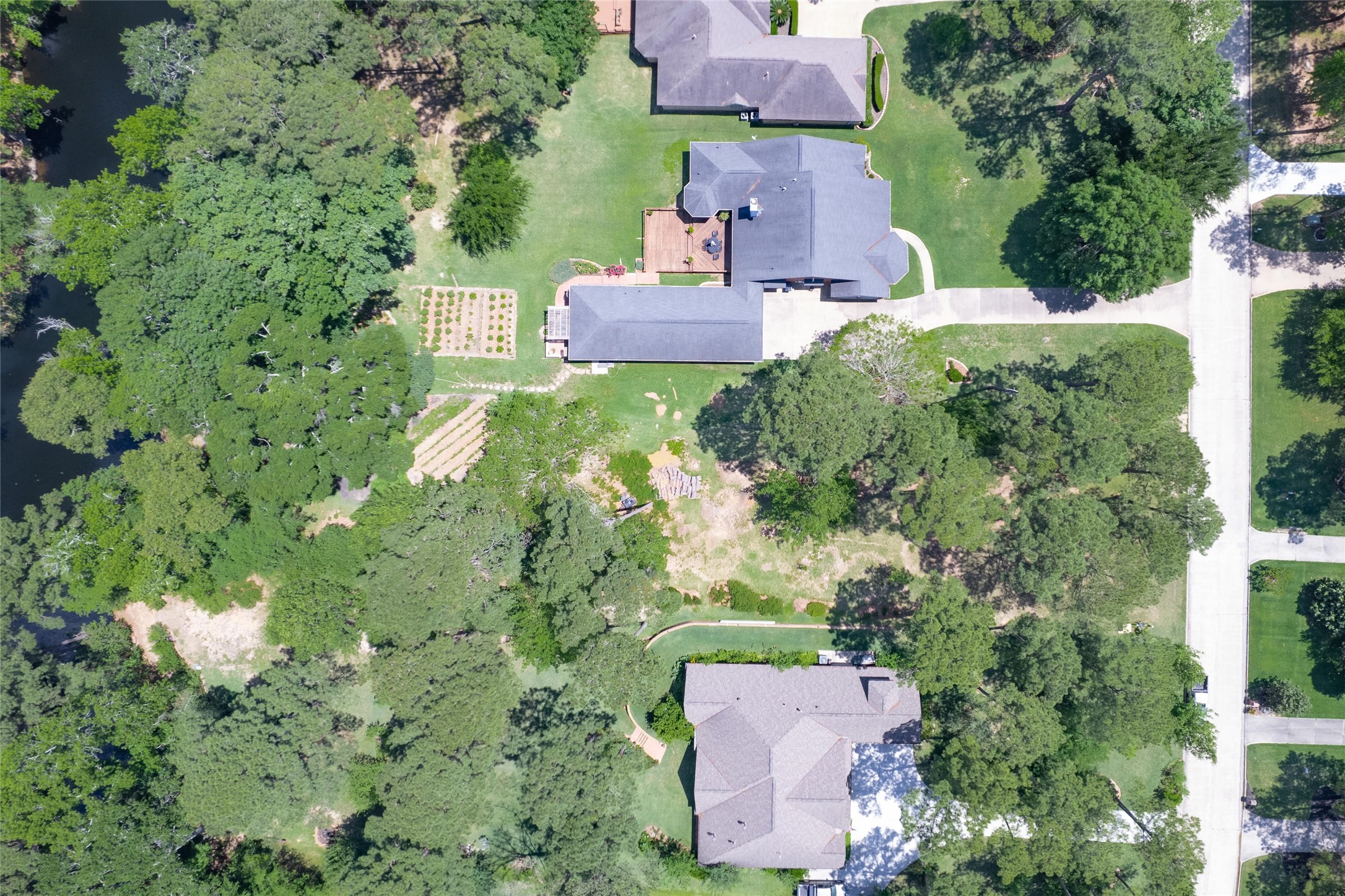 12868 Aries Loop Willis, TX 77318 - Photo 10 of 15 an aerial view of a house with a yard